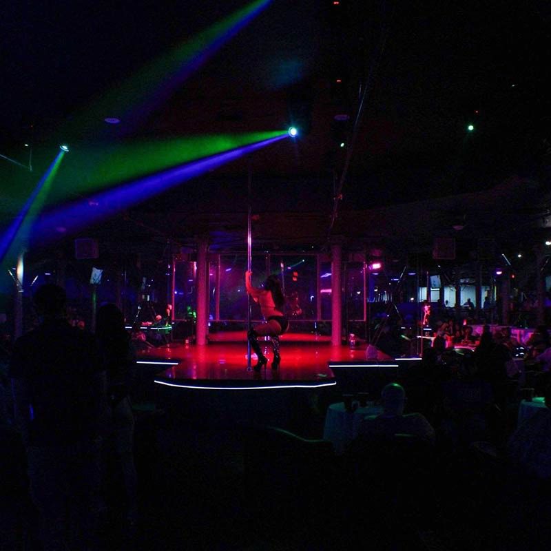 The main room at Club Volcano under green and blue lasers